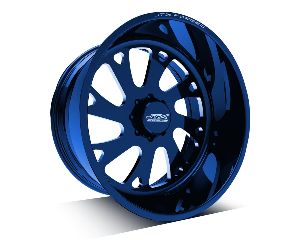 Blue JTX Forged wheel with intricate design.
