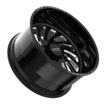 Black shiny alloy wheel on black background.