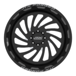 Black alloy wheel with JTX Forged logo.