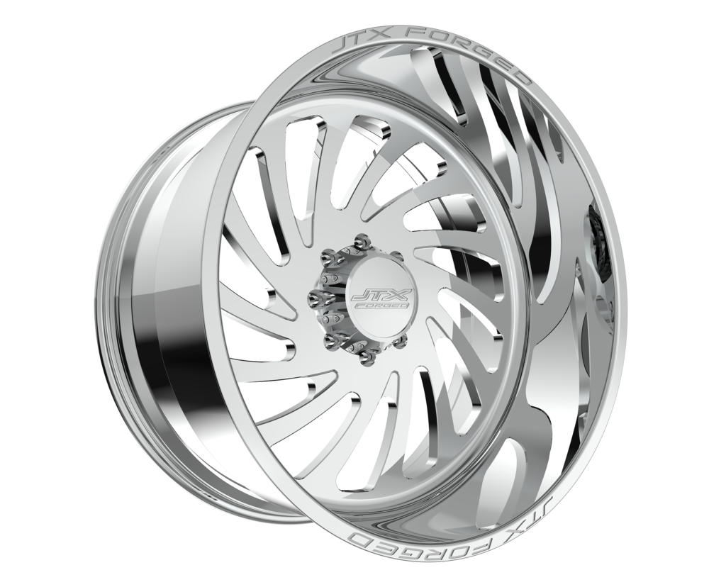Chrome car wheel with intricate design.