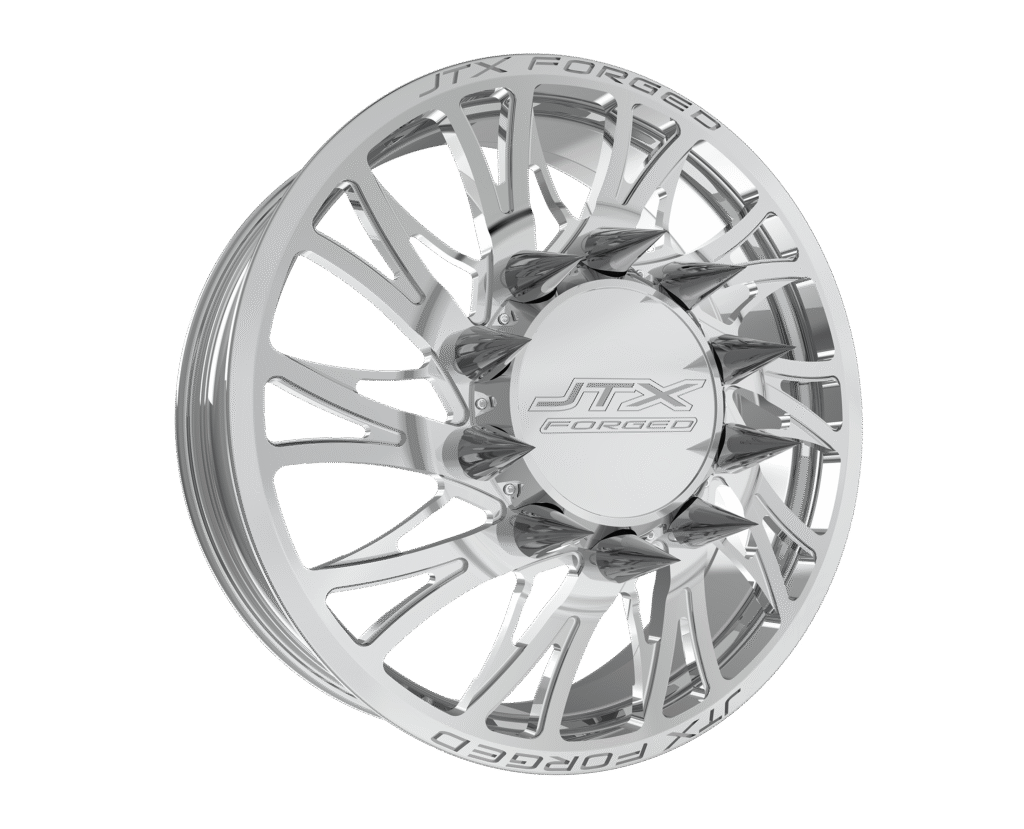 Chrome car wheel with intricate spoke design.