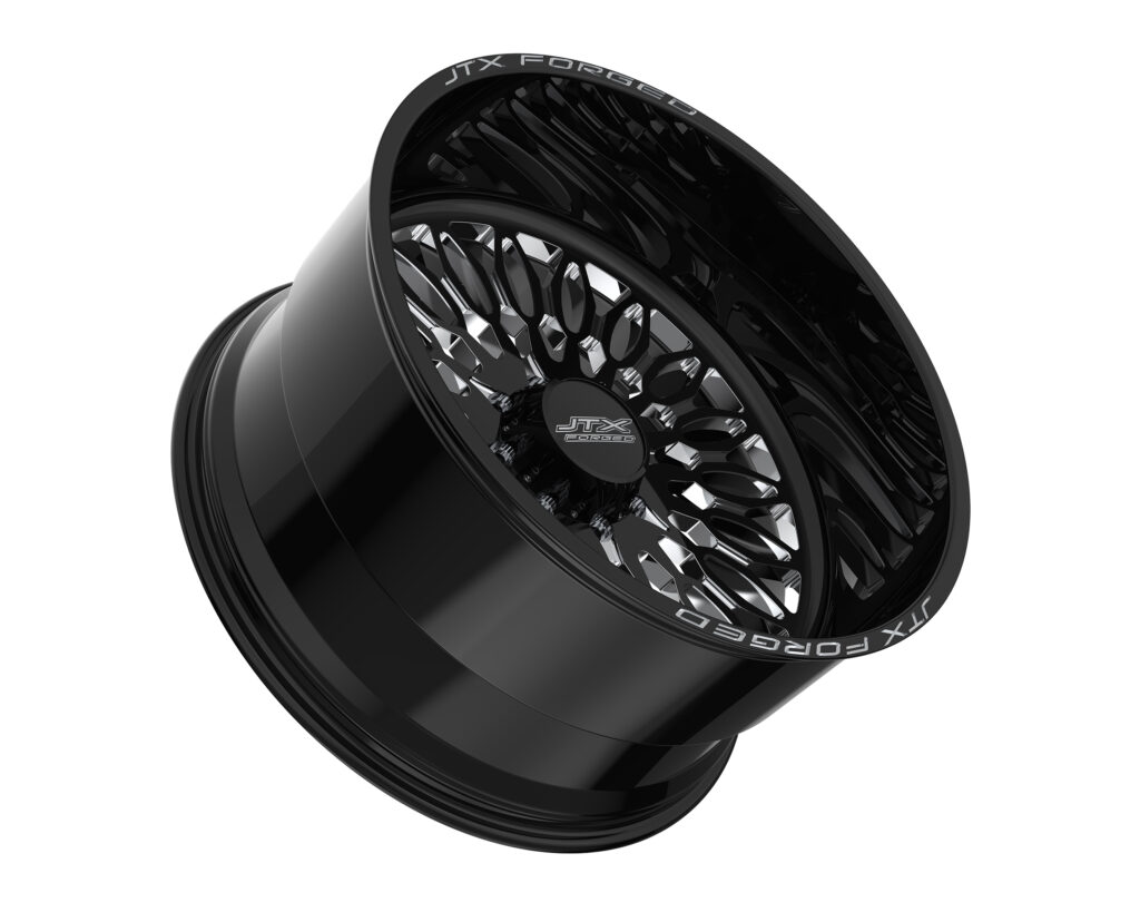 Black alloy wheel with intricate design.