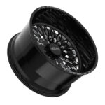 Black alloy wheel with intricate design.