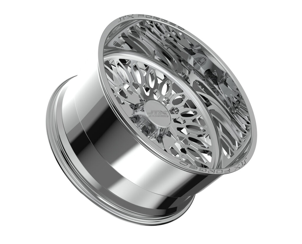 Chrome alloy wheel with intricate design pattern.