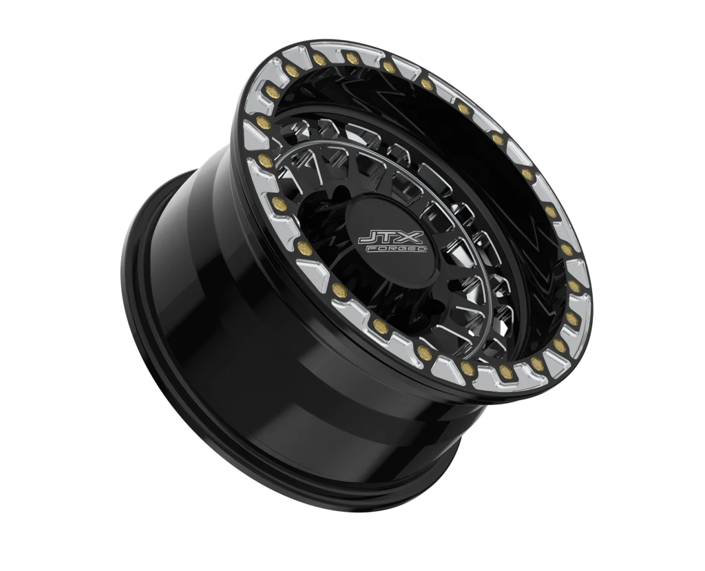 Black alloy wheel with decorative detailing.