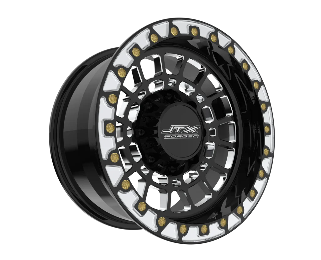 Black and silver JTX truck wheel rim.