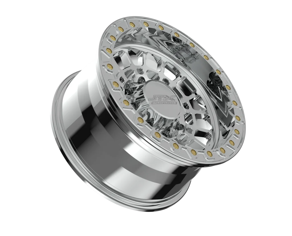 Chrome car wheel rim on black background.