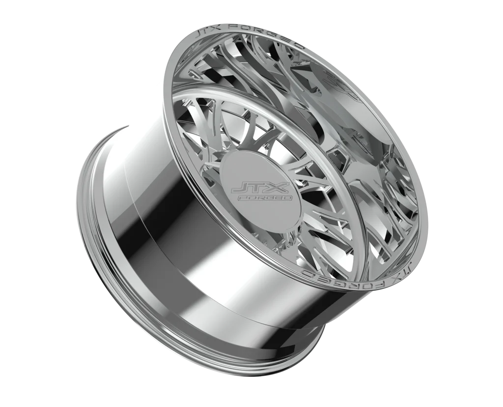 Chrome alloy car wheel rim on black.