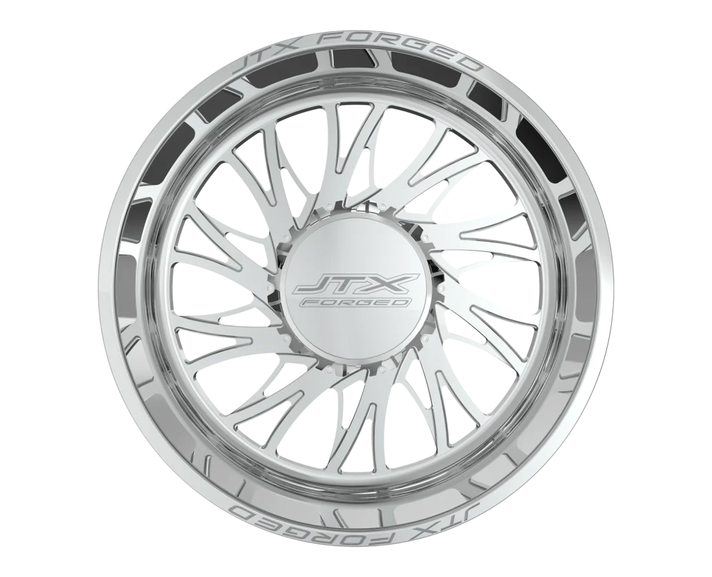 Silver custom car wheel with intricate design.