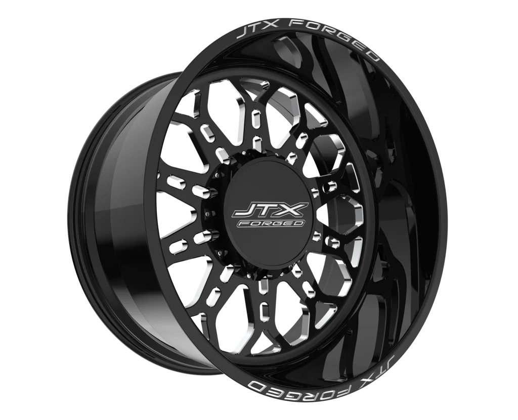Black JTX Forged wheel with intricate design.
