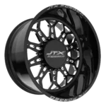 Black JTX Forged wheel with intricate design.