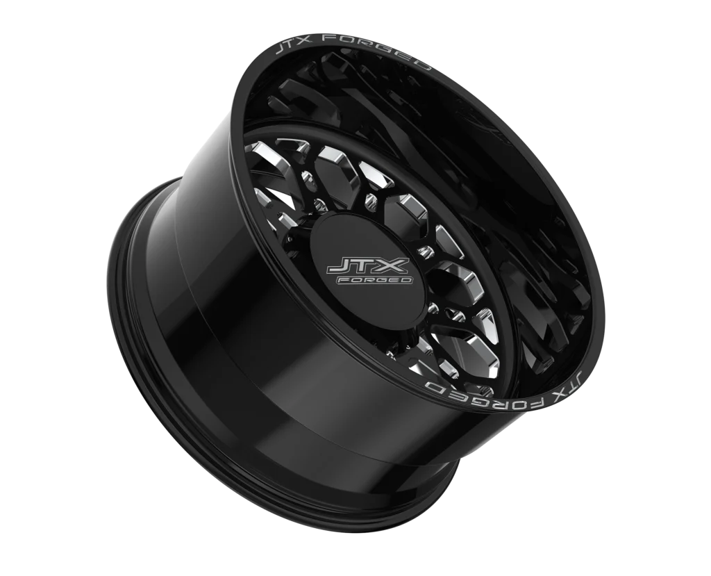 Black alloy wheel with JTX Force branding.
