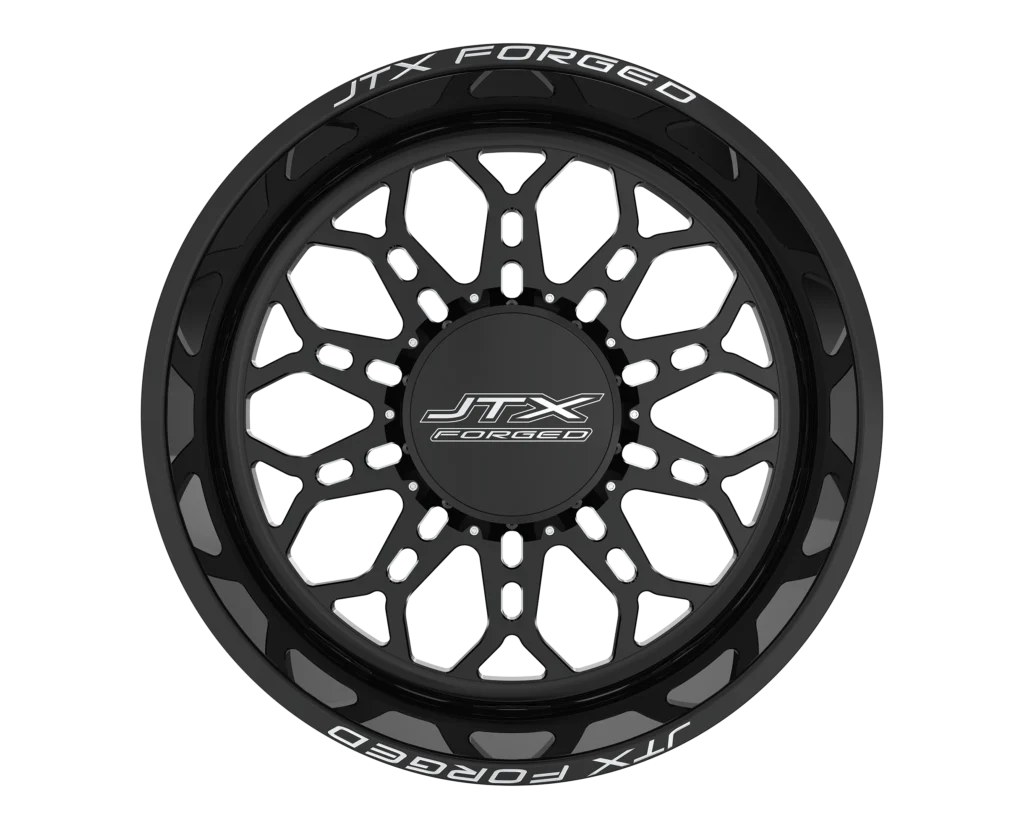 Black JTX Forged wheel with intricate design.