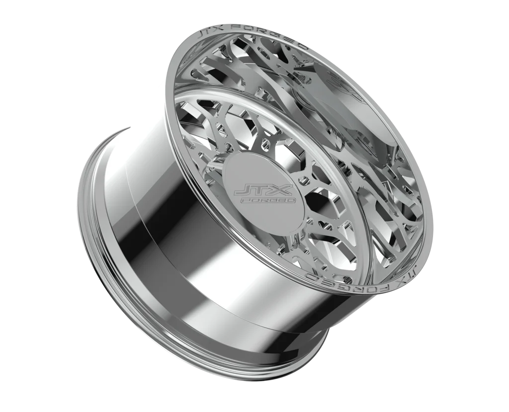 Chrome wheel rim with intricate design.