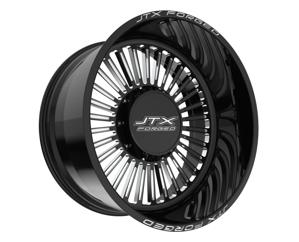 Black JTX Forged wheel with intricate design.