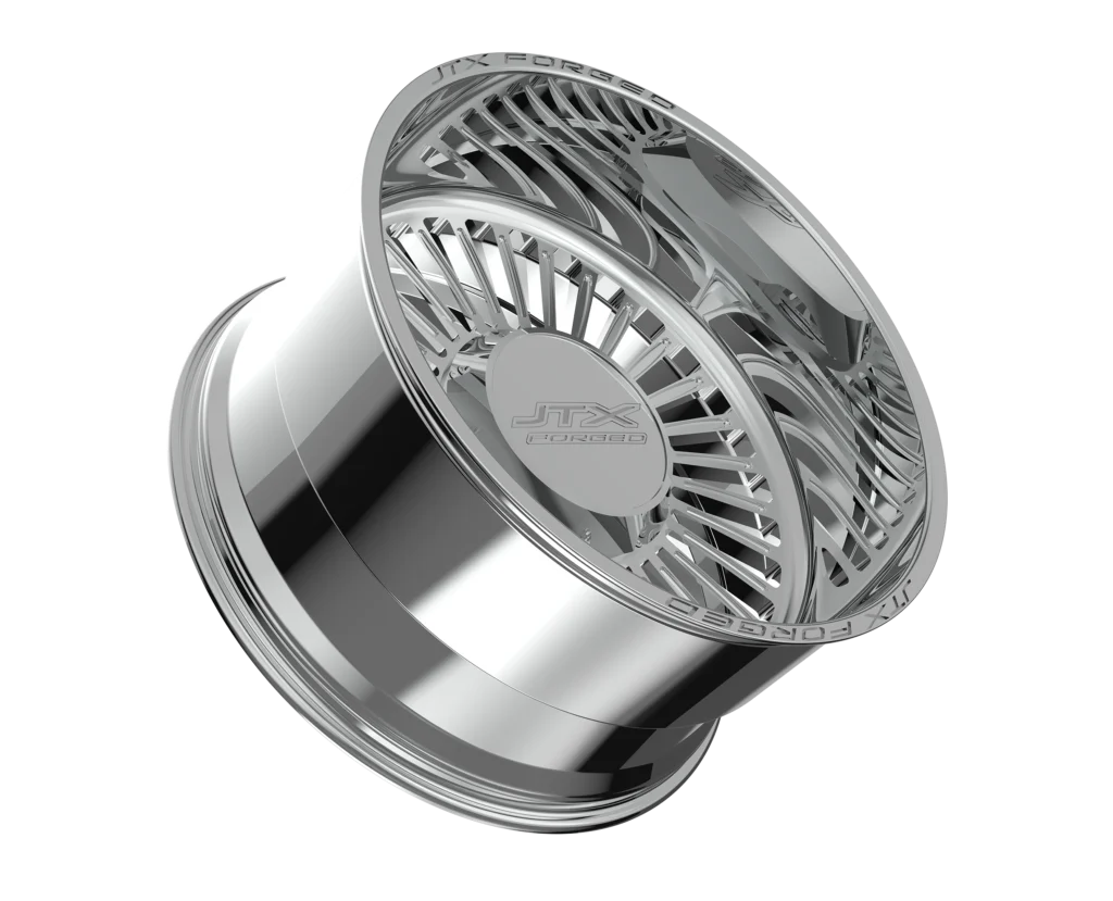 Chrome car wheel rim on black background.